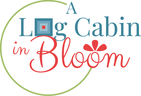 A Log Cabin in Bloom Logo